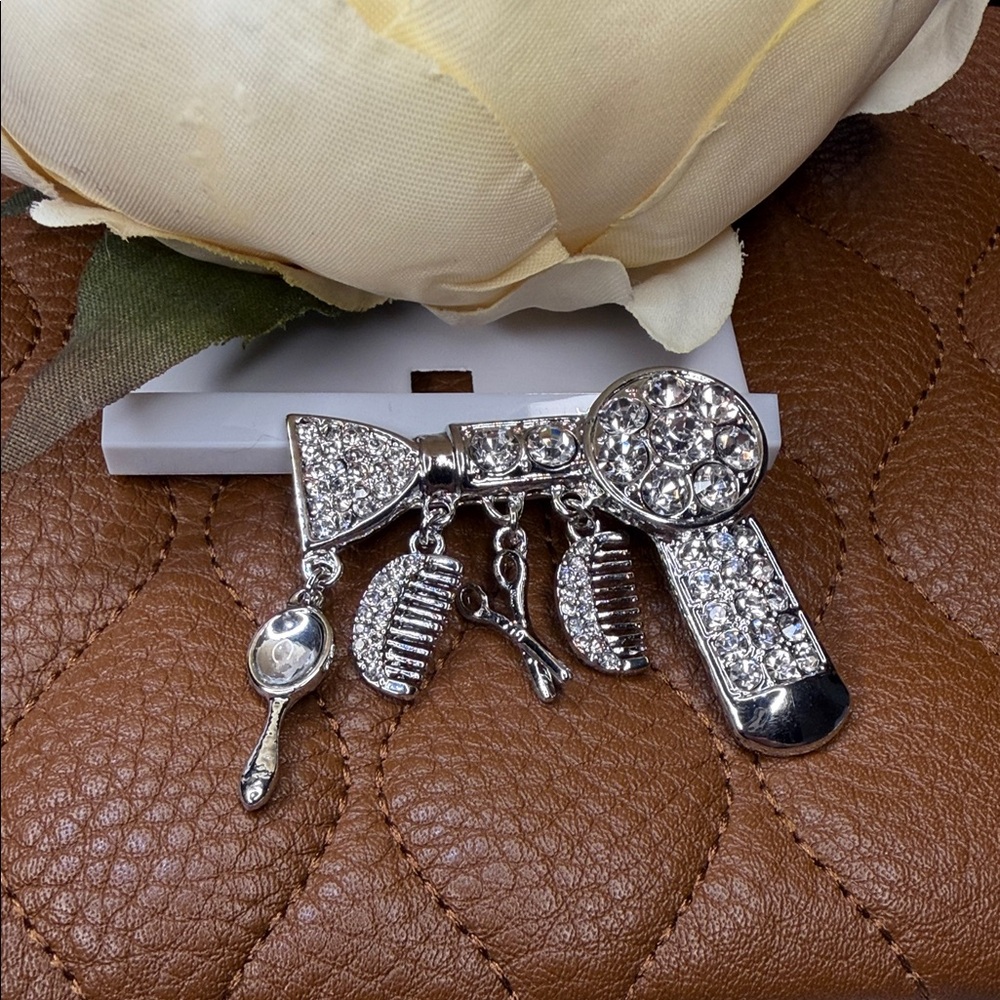 Elegant Silver Hair Dryer Brooch